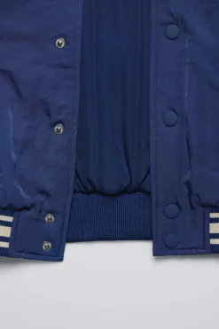 BOMBER TEXTO BORDADO