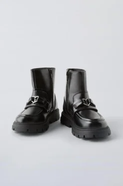 BOTA ADORNO