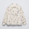 CAMISA ESTAMPADA BOTAS