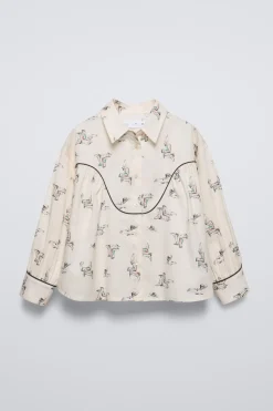 CAMISA ESTAMPADA BOTAS
