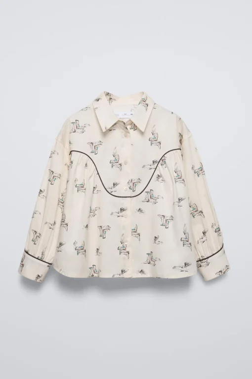 CAMISA ESTAMPADA BOTAS