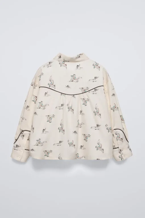 CAMISA ESTAMPADA BOTAS