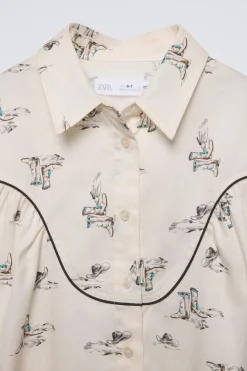 CAMISA ESTAMPADA BOTAS