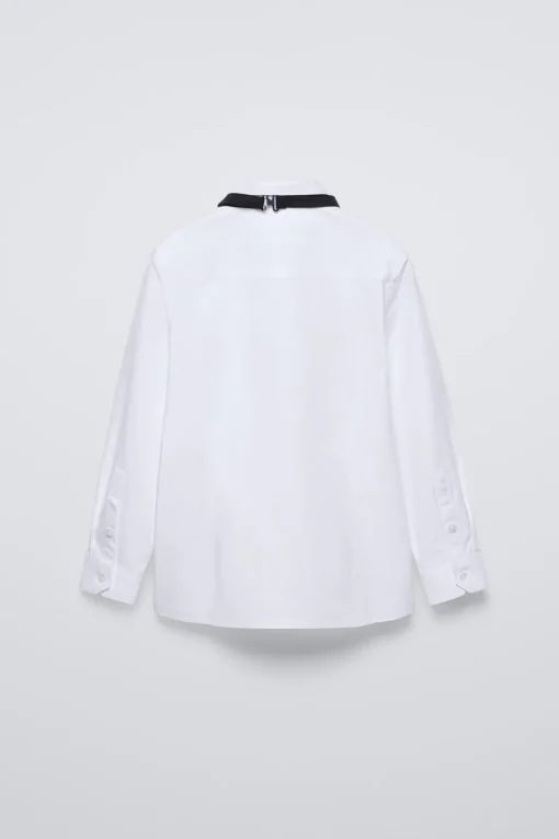 CAMISA PAJARITA SATINADA EXTRAÍBLE
