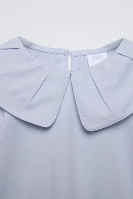 CAMISETA CUELLO PINZAS