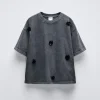 CAMISETA EFECTO LAVADO APLIQUE FLORES
