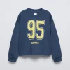 CAMISETA VARSITY TEXTO
