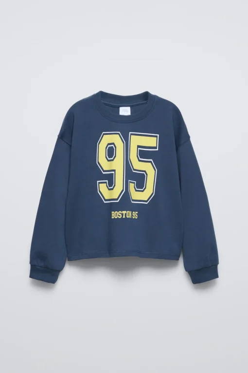CAMISETA VARSITY TEXTO