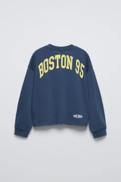CAMISETA VARSITY TEXTO
