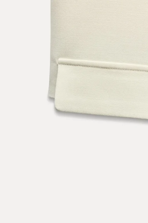 CHALECO CORTO TAPETAS
