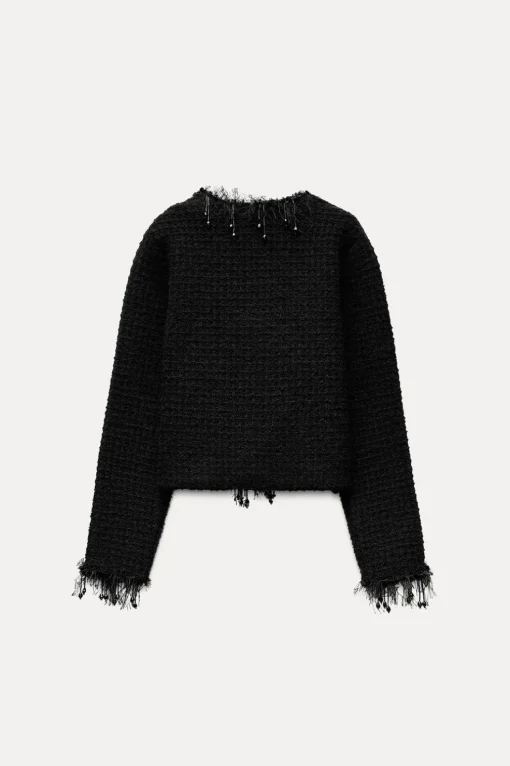 CHAQUETA PUNTO ACABADOS DESFLECADOS ABALORIOS