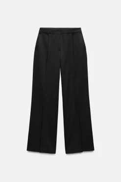 PANTALÓN ANCHO BAJO ABERTURAS