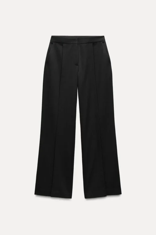 PANTALÓN ANCHO BAJO ABERTURAS