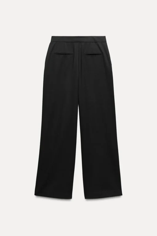 PANTALÓN ANCHO BAJO ABERTURAS