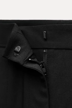 PANTALÓN ANCHO BAJO ABERTURAS