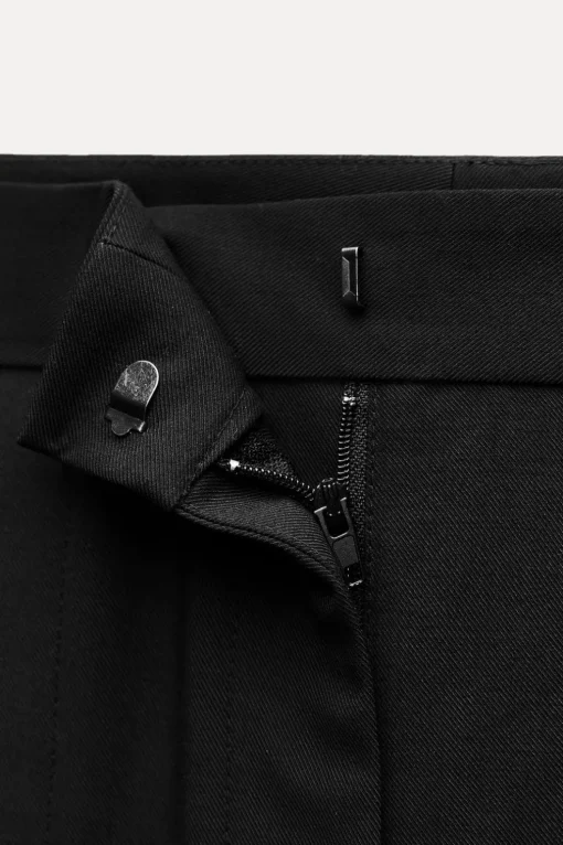 PANTALÓN ANCHO BAJO ABERTURAS