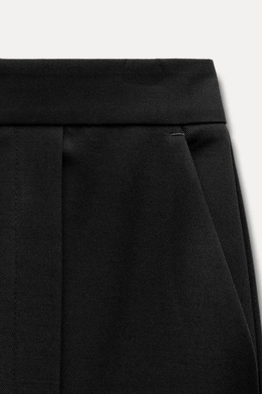 PANTALÓN ANCHO BAJO ABERTURAS
