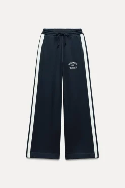 PANTALÓN FELPA TEXTO BANDA LATERAL