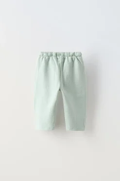 PANTALÓN LISO BOLSILLOS