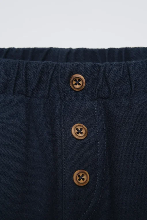 PANTALÓN SARGA BOLSILLOS