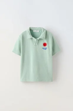 POLO TOALLA BORDADO SOL