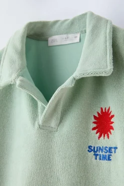 POLO TOALLA BORDADO SOL