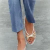 SANDALIA METALIZADA TIRAS NUDO