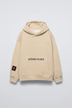 SUDADERA CAPUCHA X RICARDO CAVOLO