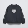 SUDADERA CORAZONES BRILLO