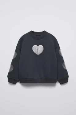 SUDADERA CORAZONES BRILLO