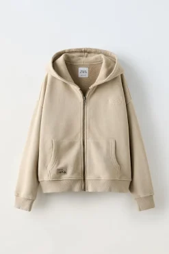 SUDADERA CREMALLERA LAVADA ETIQUETA