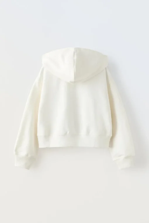 SUDADERA CREMALLERA TEXTO CROP FIT