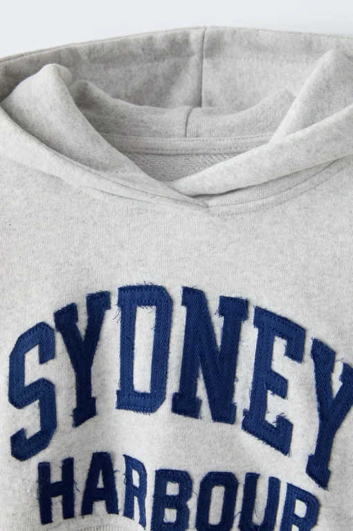 SUDADERA CROPPED TEXTO