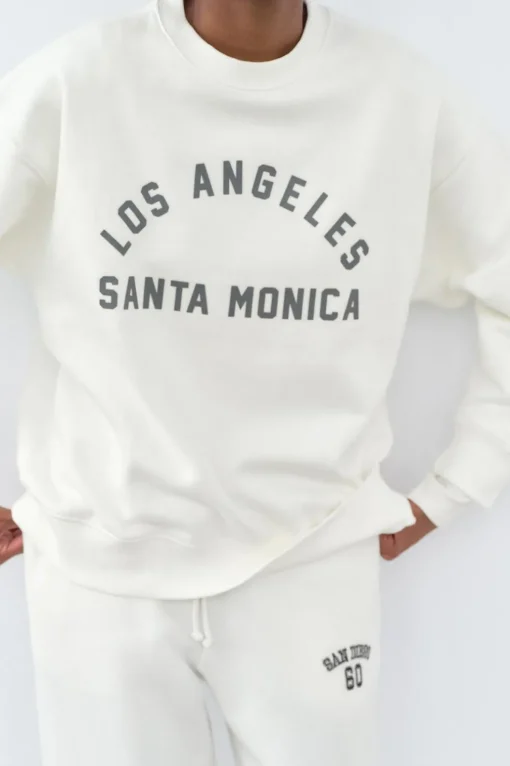 SUDADERA EFECTO LAVADO TEXTO ENGOMADO