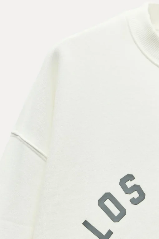 SUDADERA EFECTO LAVADO TEXTO ENGOMADO