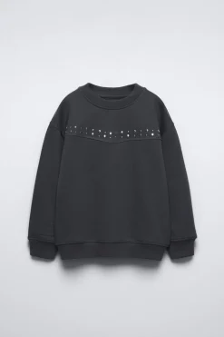 SUDADERA TACHAS