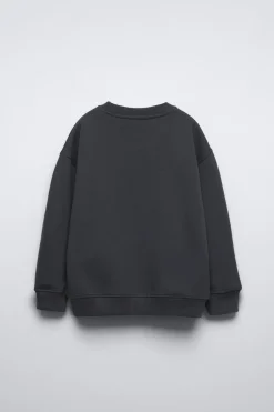 SUDADERA TACHAS