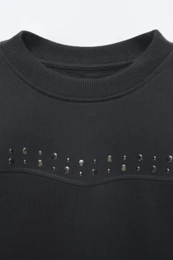 SUDADERA TACHAS