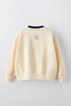 SUDADERA TEXTO FLOCK