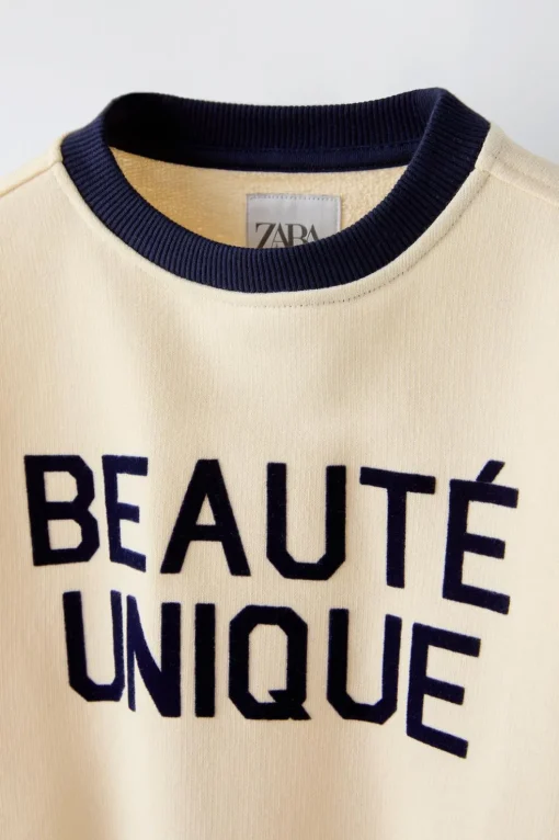 SUDADERA TEXTO FLOCK