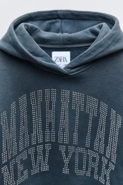 SUDADERA TEXTO STRASS